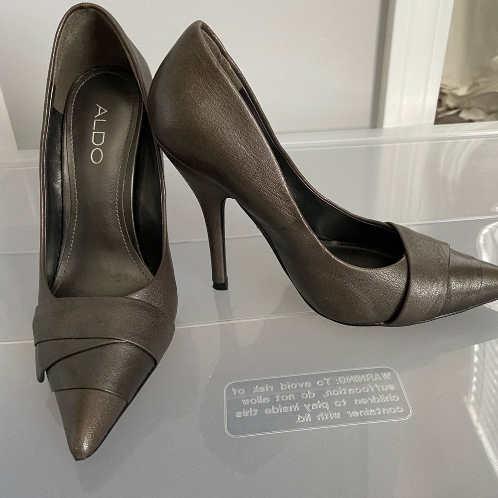 Pewter colored aldo heel.